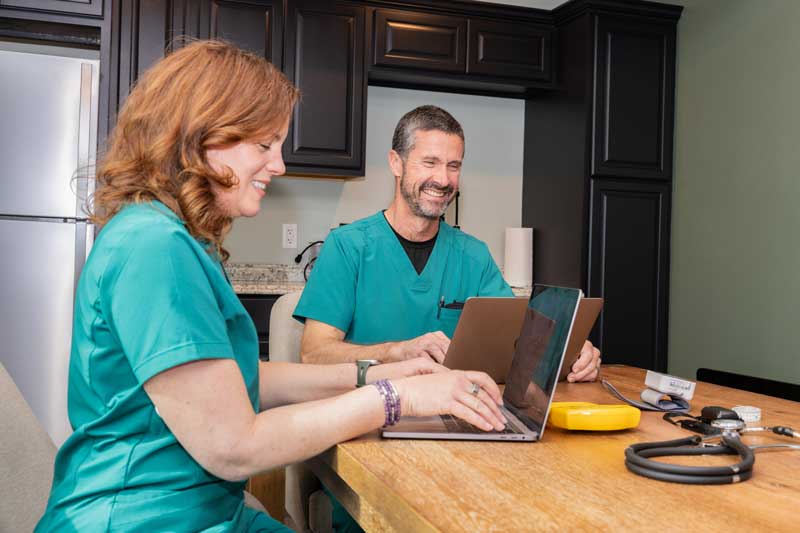 Mark and Tandi working on computers